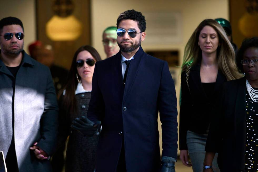 FILE - In this March 26, 2019 file photo, actor Jussie Smollett gestures as he leaves Cook Coun ...