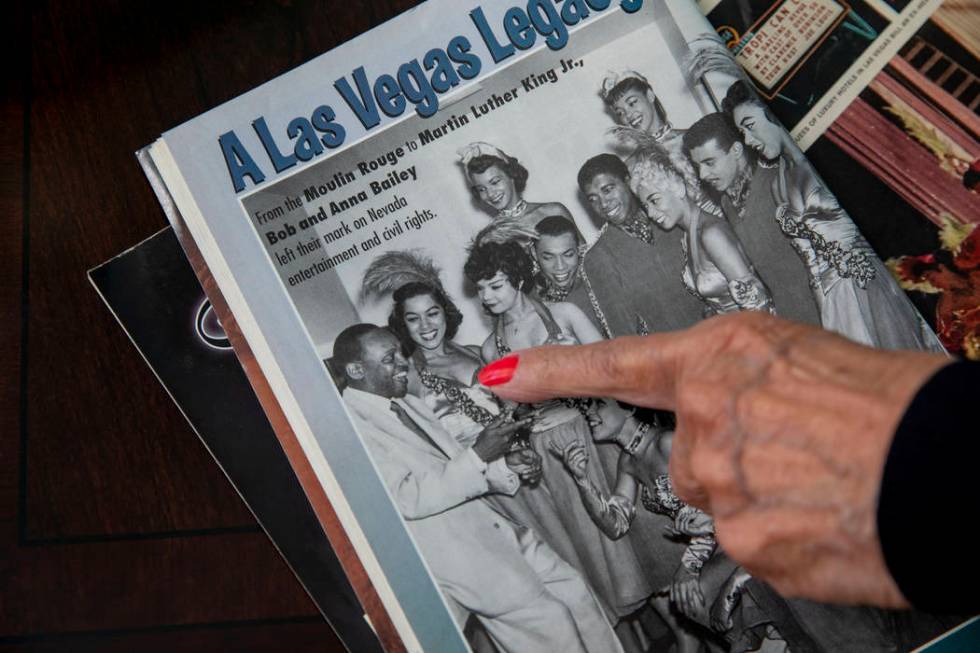 Moulin Rouge dancer Anna Bailey points to her photograph, in her home in Las Vegas on Wednesday ...