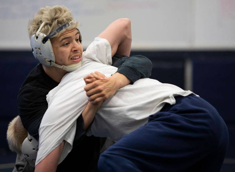 Senior Matt Van Riel, top, wrestles against senior Weston Presser, bottom, during the last prac ...