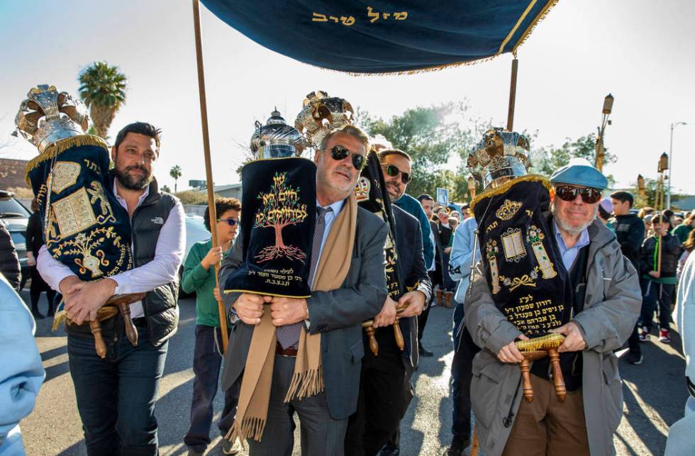 Chabad of Southern Nevada members join their new Torah with the three existing ones into to the ...