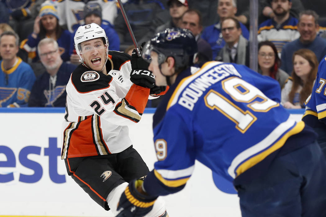 St. Louis Blues' Jay Bouwmeester (19) handles the puck as Anaheim Ducks' Carter Rowney (24) def ...