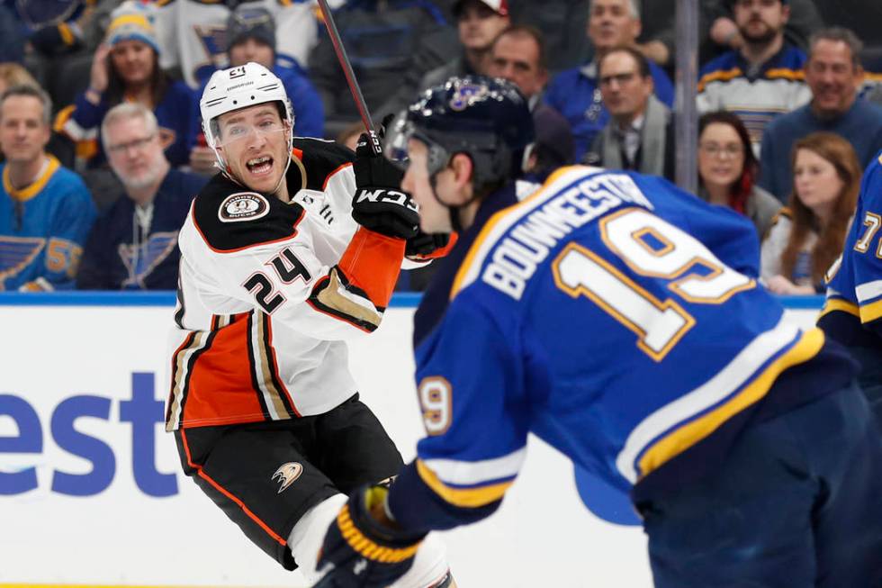 St. Louis Blues' Jay Bouwmeester (19) handles the puck as Anaheim Ducks' Carter Rowney (24) def ...