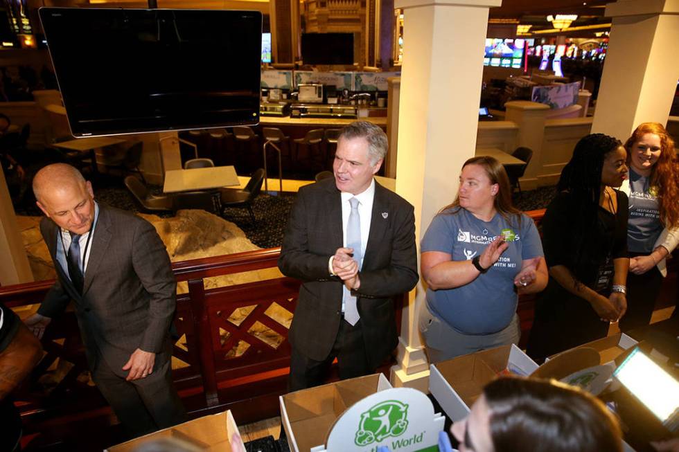 Raiders president Marc Badain, from left, Jim Murren, MGM Resorts CEO and chairman, and Sheree ...