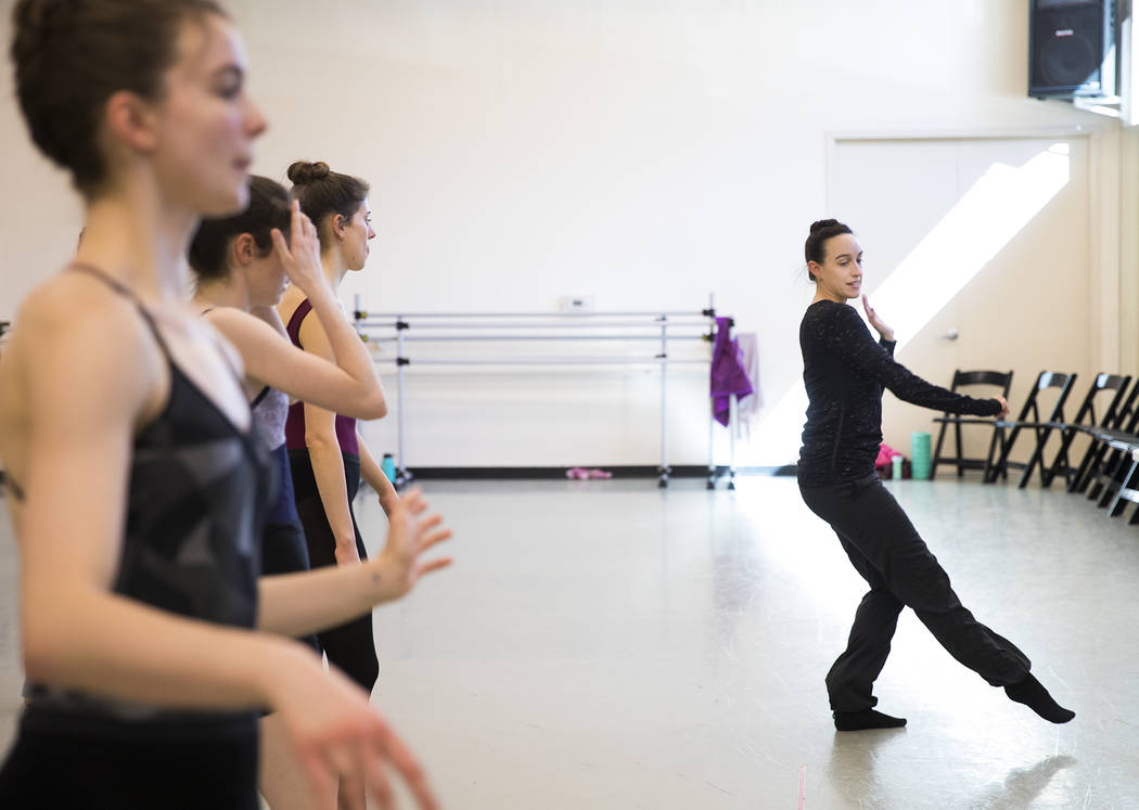 Krista Baker, director and choreographer, far right, directs dancers during a rehearsal for her ...