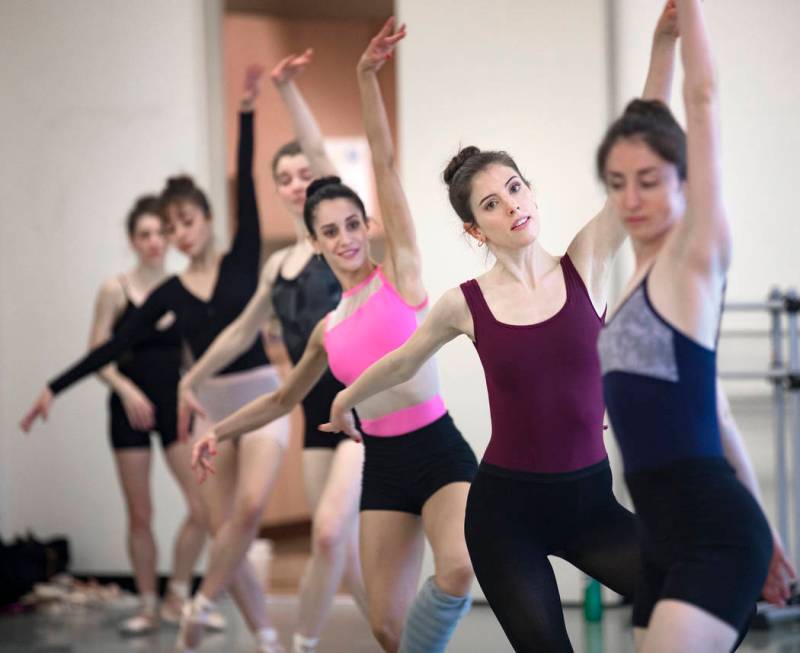 Katie Zimmerman dances in a line with others during rehearsal for "The Current," an original wo ...