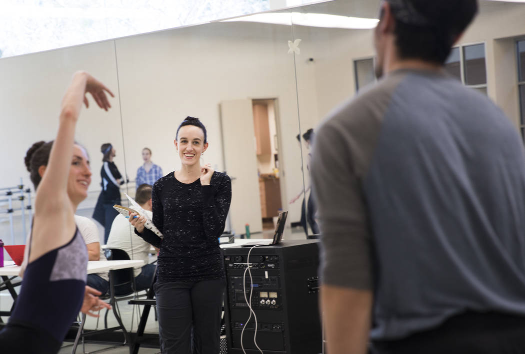 Krista Baker, director and choreographer, center, directs dancers Emma McGirr, left, and Steven ...