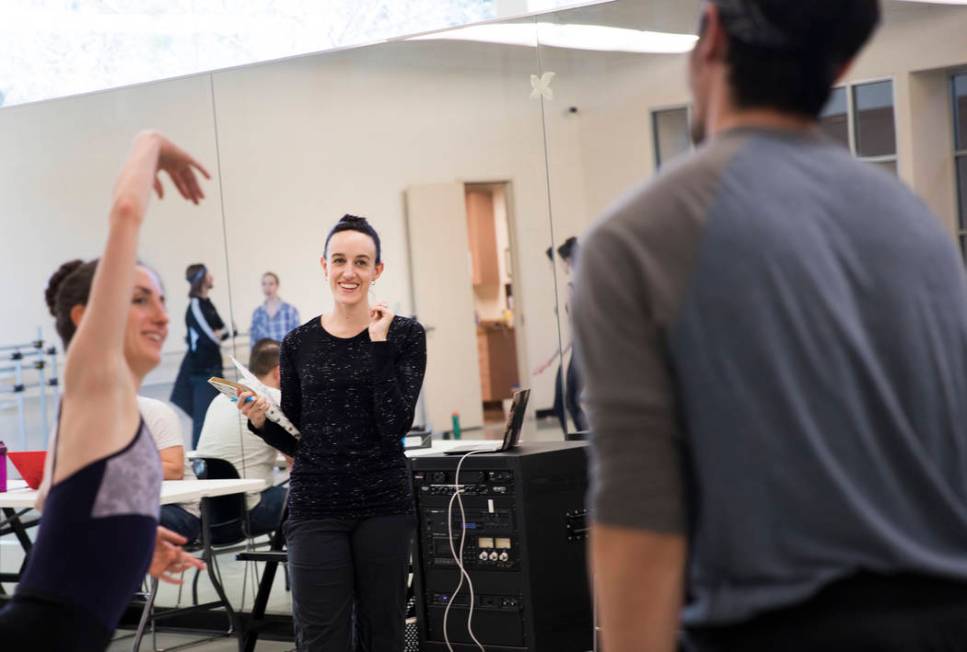 Krista Baker, director and choreographer, center, directs dancers Emma McGirr, left, and Steven ...