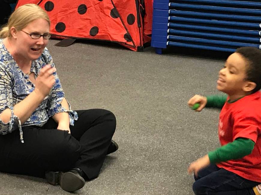 Emily Rawlings with Dynamic Music Therapy leads preschoolers during a music therapy session as ...