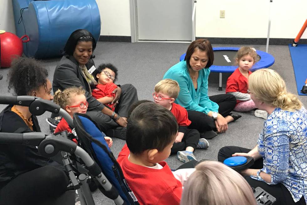 Preschoolers, their parents and employees participate in a music therapy session Feb. 12 at the ...