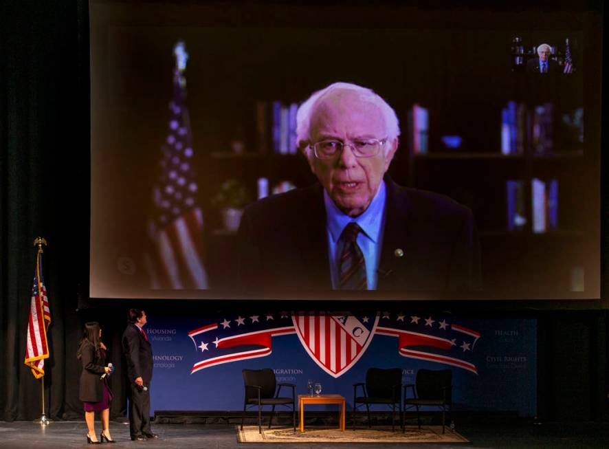 Sen. Bernie Sanders, I-Vt., above, fields questions from Leticia Castro and Domingo Garcia of t ...