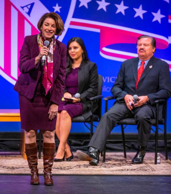 Sen. Amy Klobuchar, D-Minn., left, answers questions in front of Leticia Castro and Domingo Gar ...