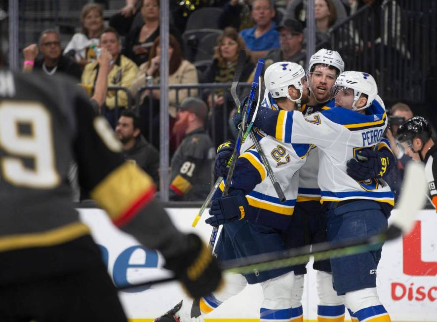 St. Louis Blues defenseman Alex Pietrangelo (27), St. Louis Blues left wing Zach Sanford (12) a ...