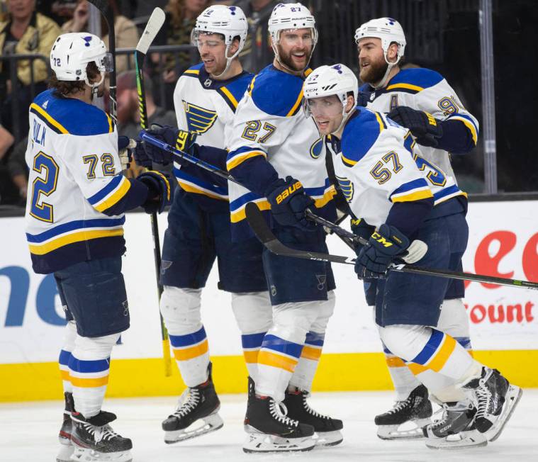 St. Louis Blues defenseman Justin Faulk (72), St. Louis Blues left wing Zach Sanford (12), St. ...