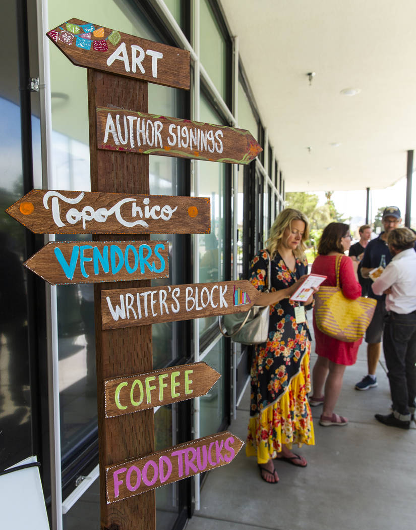 A crossroads sign directs participants during the Believer Festival, a three-day literary/art/c ...