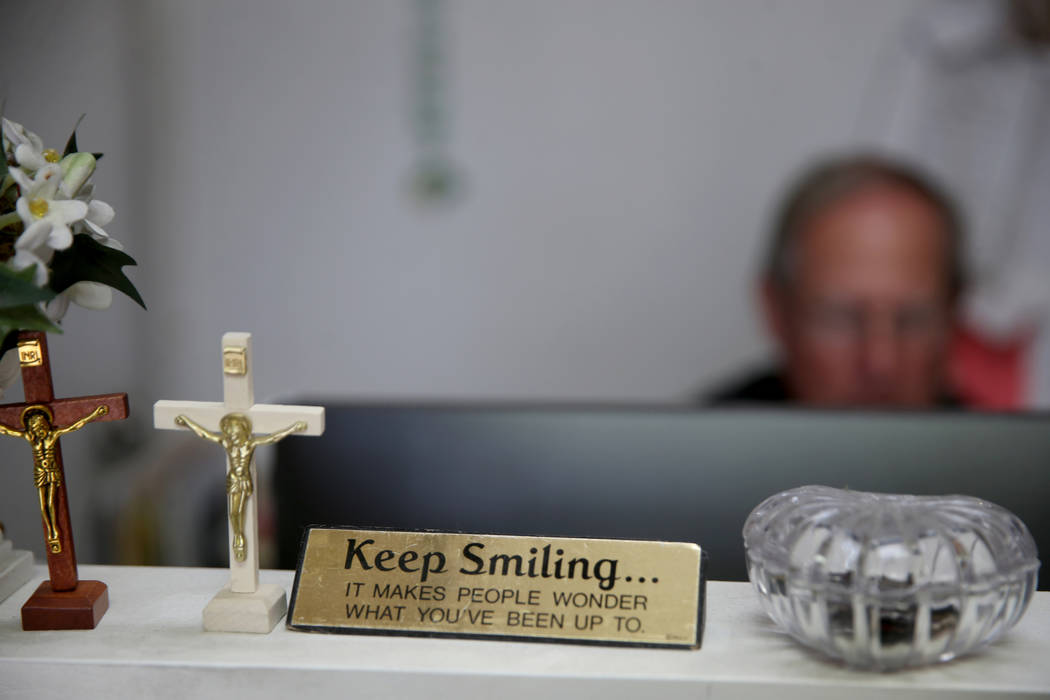 The Rev. Courtney Krier works in his office after a free breakfast at St. Joseph's Catholic Chu ...
