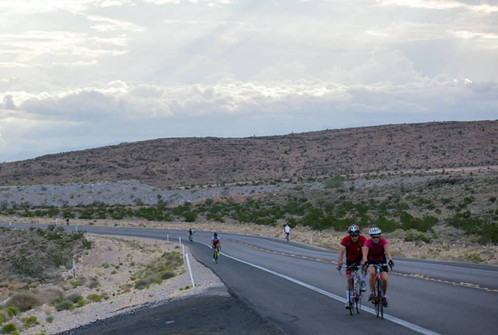 Cyclists ride along State Route 159 in Red Rock Canyon National Conservation Area in Las Vegas ...