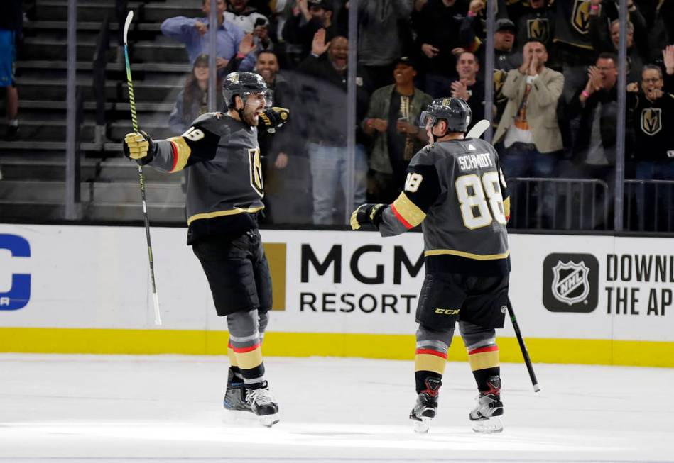 Vegas Golden Knights right wing Alex Tuch (89) and defenseman Nate Schmidt celebrate a Golden K ...