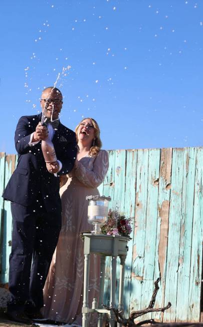 Richard Raney and Laura Eshelman of Overland Park, Kan., celebrate after getting married during ...