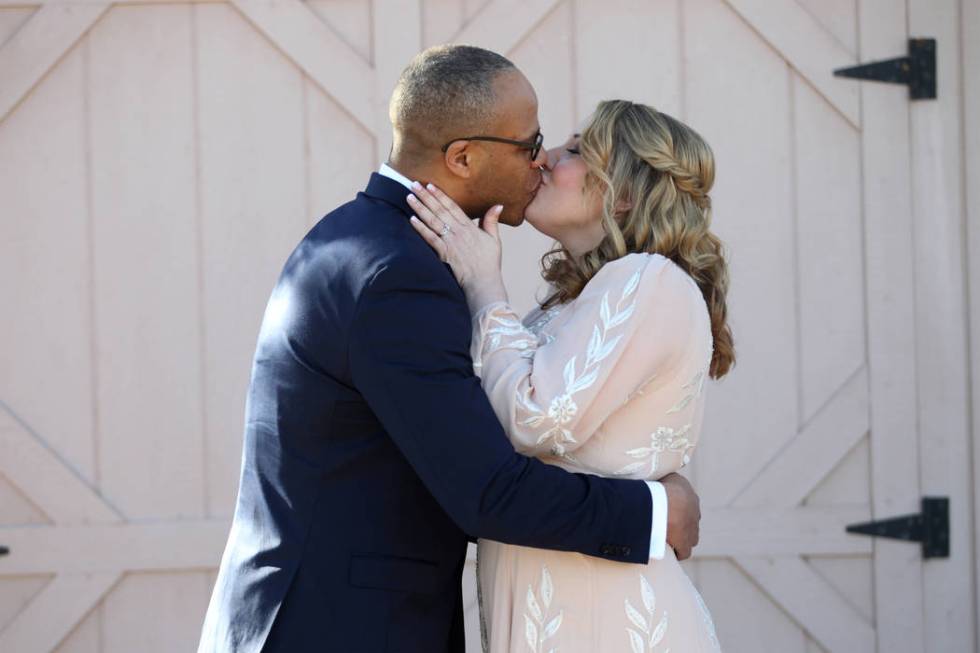 Richard Raney and Laura Eshelman of Overland Park, Kan., share a kiss in their wedding during t ...