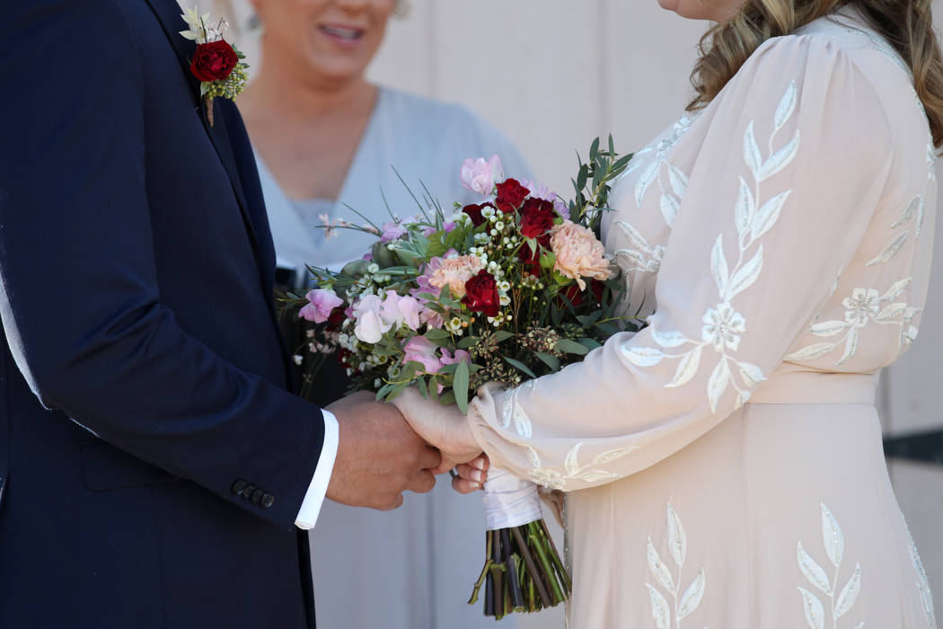 Richard Raney and Laura Eshelman of Overland Park, Kan., get married by wedding officiant Angie ...