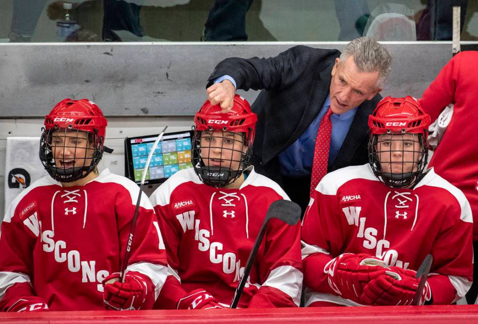 Wisconsin Badgers head coach Mark Johnson talks with his players during an NCAA college women&# ...