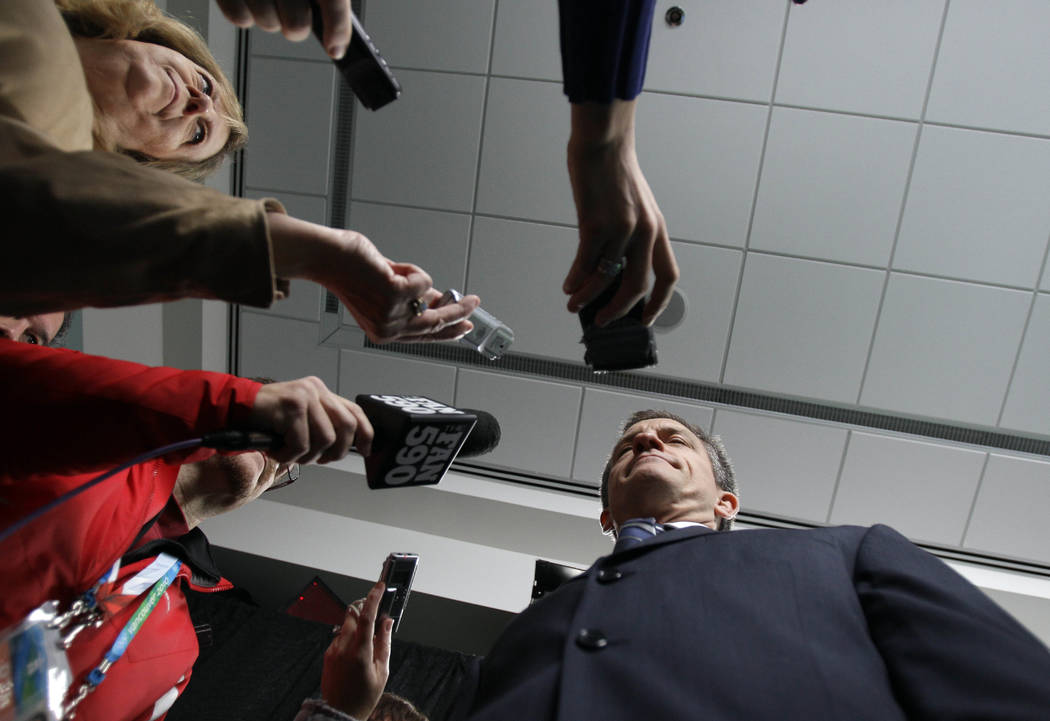 USA women's ice hockey coach Mark Johnson is interviewed during a press conference in Vancouver ...