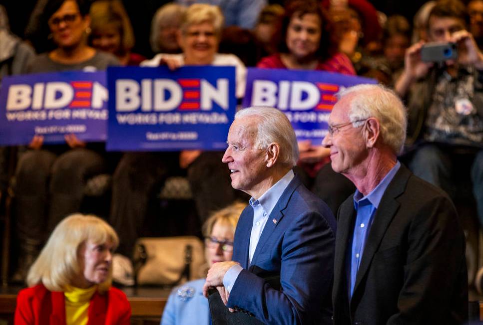 Former Vice President Joe Biden, left, looks on while sitting beside Capt. Chesley "Sully ...