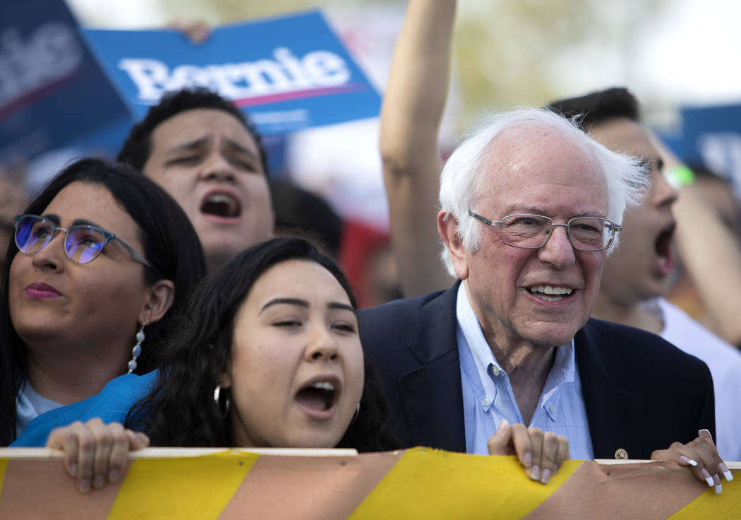 Sen. Bernie Sanders marches from Desert Pines High School to a polling location during the &quo ...