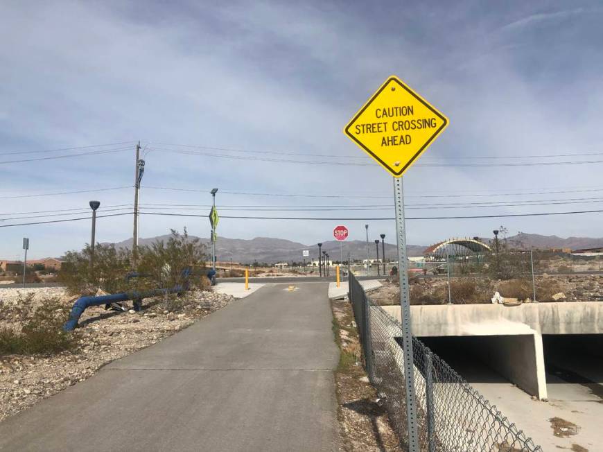 A sign warning of a street crossing ahead near where two children were hit by a truck on Friday ...