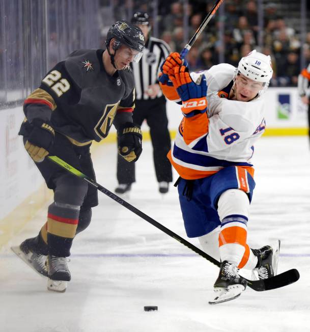 Vegas Golden Knights defenseman Nick Holden (22) and New York Islanders forward Anthony Beauvil ...