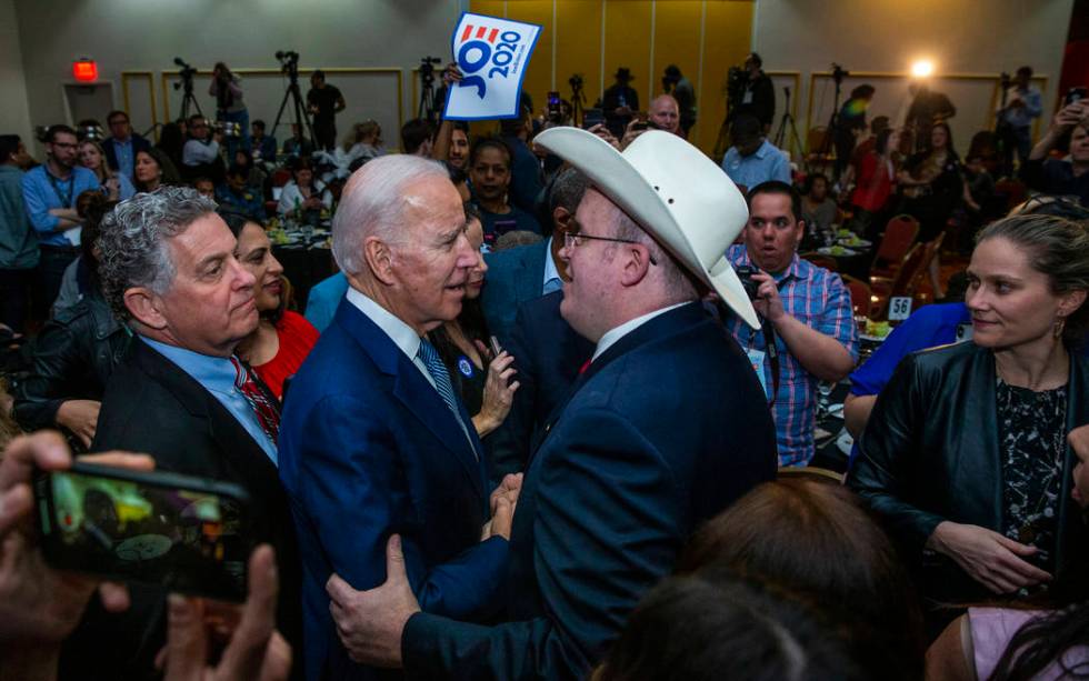 Former Vice President Joe Biden, left, speaks with Andrew Pritt of Warren, Ark., during the Cla ...