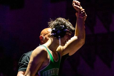 Green Valley's Caleb Uhlenhopp is awarded the win over Spanish Spring's Anthony Sissom in their ...