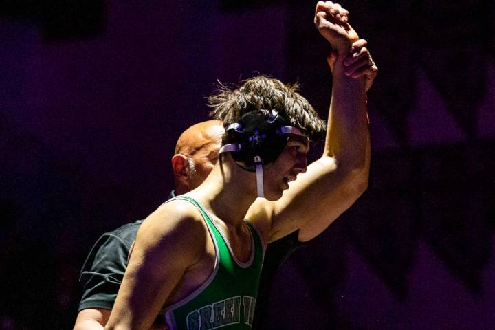 Green Valley's Caleb Uhlenhopp is awarded the win over Spanish Spring's Anthony Sissom in their ...