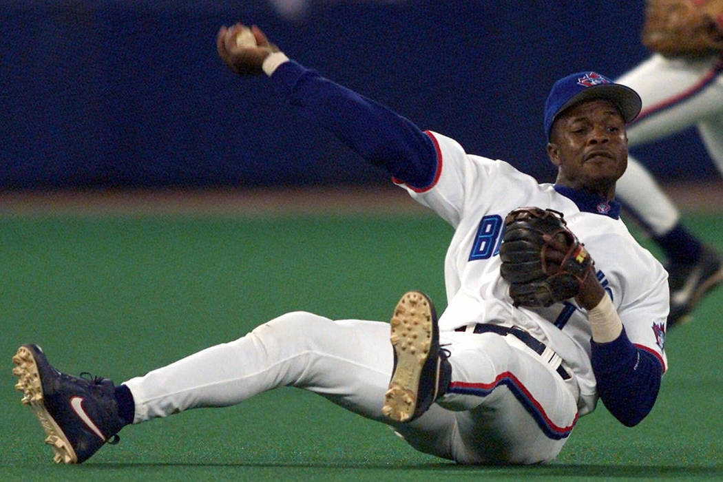 In this Sept. 17, 1999, file photo, Toronto Blue Jays third baseman Tony Fernandez throws to fi ...