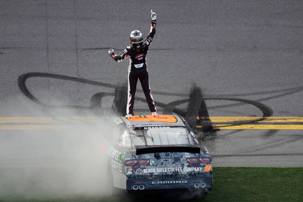 Noah Gragson celebrates on the roof of his car after winning the NASCAR Xfinity series auto rac ...