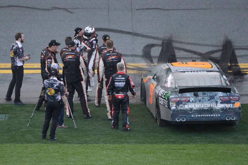 Noah Gragson celebrates with his crew after winning the NASCAR Xfinity series auto race Saturda ...