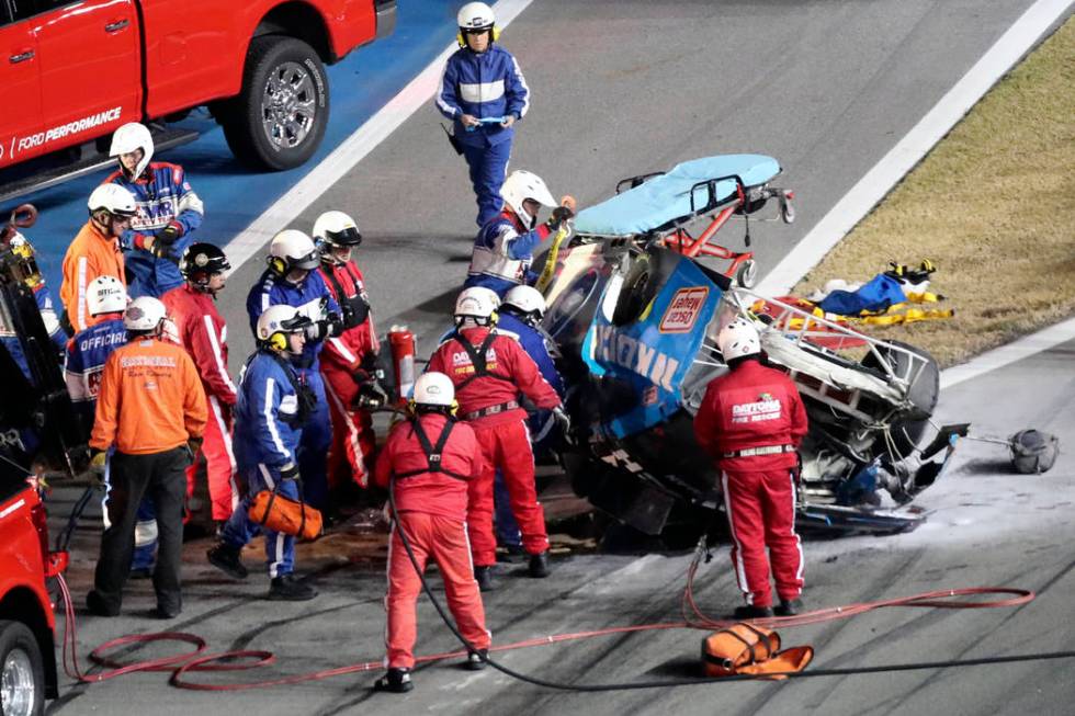 Rescue workers arrive to check on Ryan Newman after he was involved in a wreck on the last lap ...