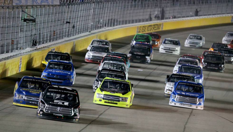 Kyle Busch (51) leads the pack during a re-start in the Strat 200 NASCAR Truck Series race at L ...