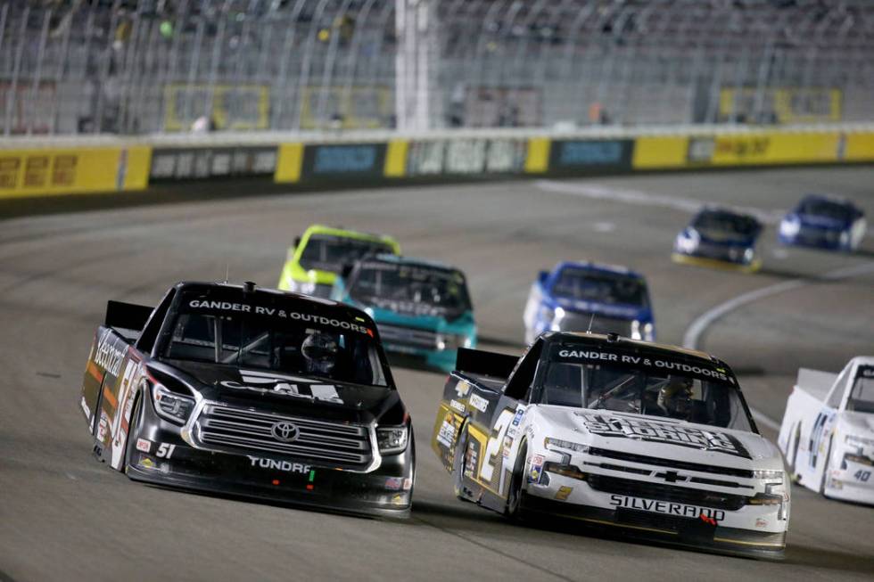 Kyle Busch (51) and Sheldon Creed (2) battle for the lead during the Strat 200 NASCAR Truck Ser ...