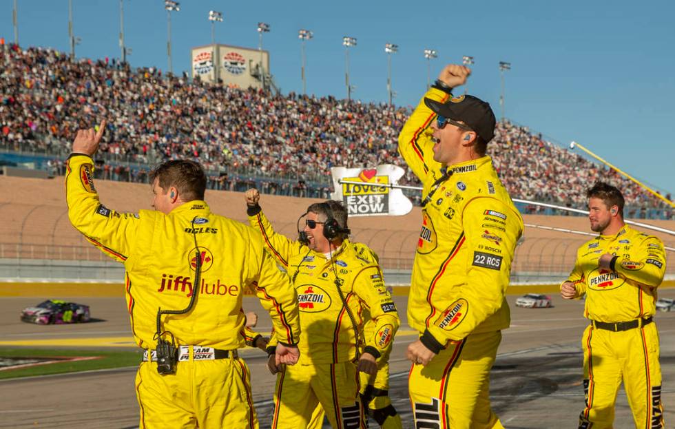 The pit crew of Joey Logano (22) celebrates their team win following the Pennzoil 400 presented ...