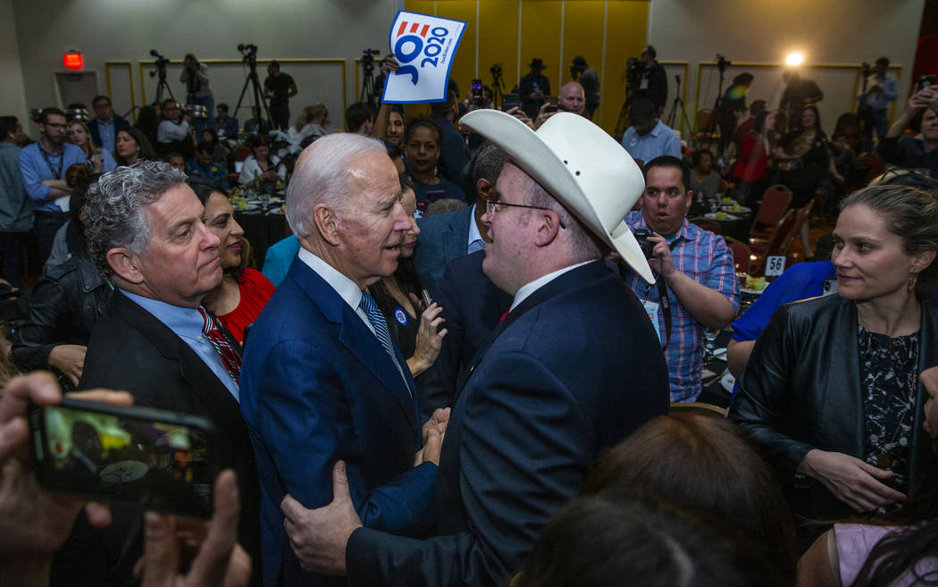 Former Vice President Joe Biden, left, speaks with Andrew Pritt of Warren, Ark., during the Cla ...