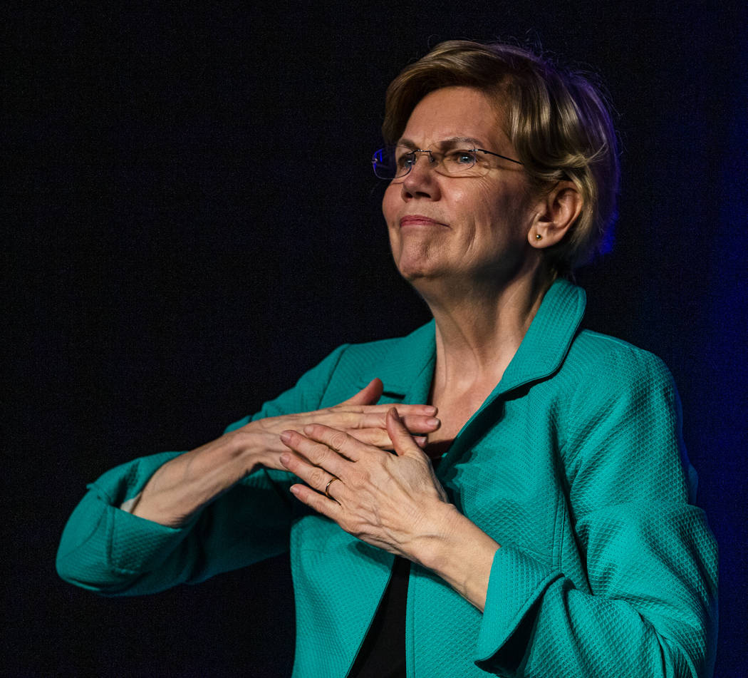 Sen. Elizabeth Warren, D-Mass., is touched by the crowd during the Clark County Democrats Kick ...