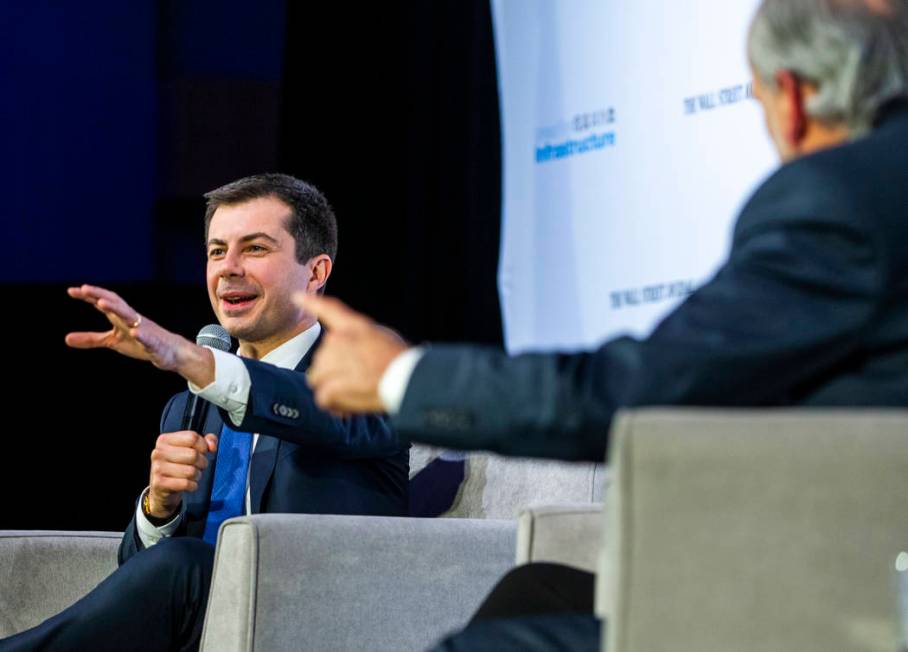 Former South Bend, Ind., Mayor Pete Buttigieg, left, answers questions from The Wall Street Jou ...