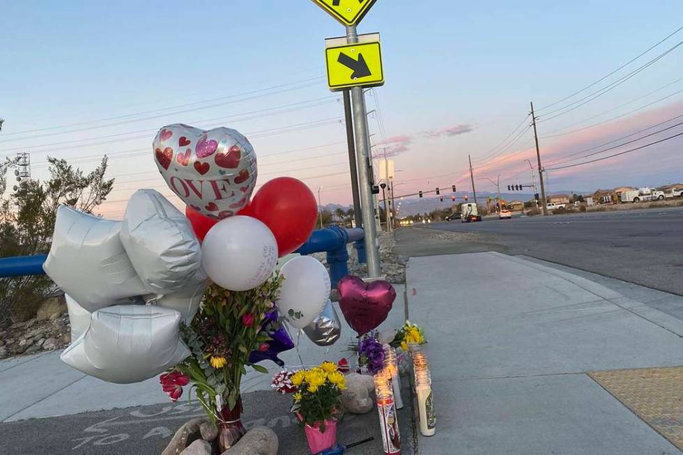 A memorial for a brother and sister hit by a truck on Friday, Feb. 14, 2020, sits next to a cro ...