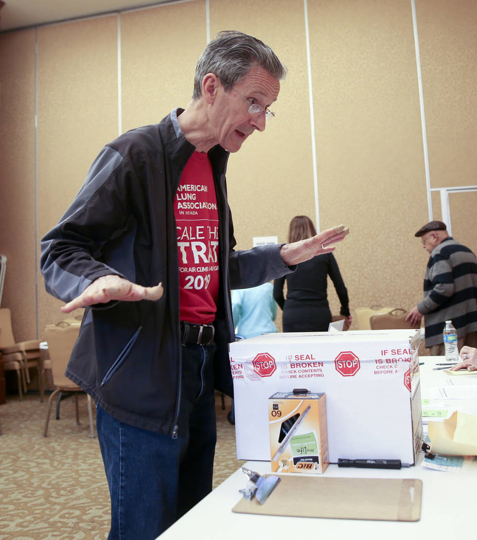 Anthony Allison, 58, of Las Vegas asks, "That's it?" after dropping his ballot during ...