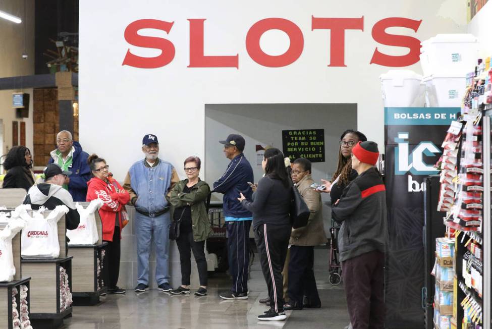 Voters line up during the last day of early voting in the Nevada Democratic caucuses at Cardena ...