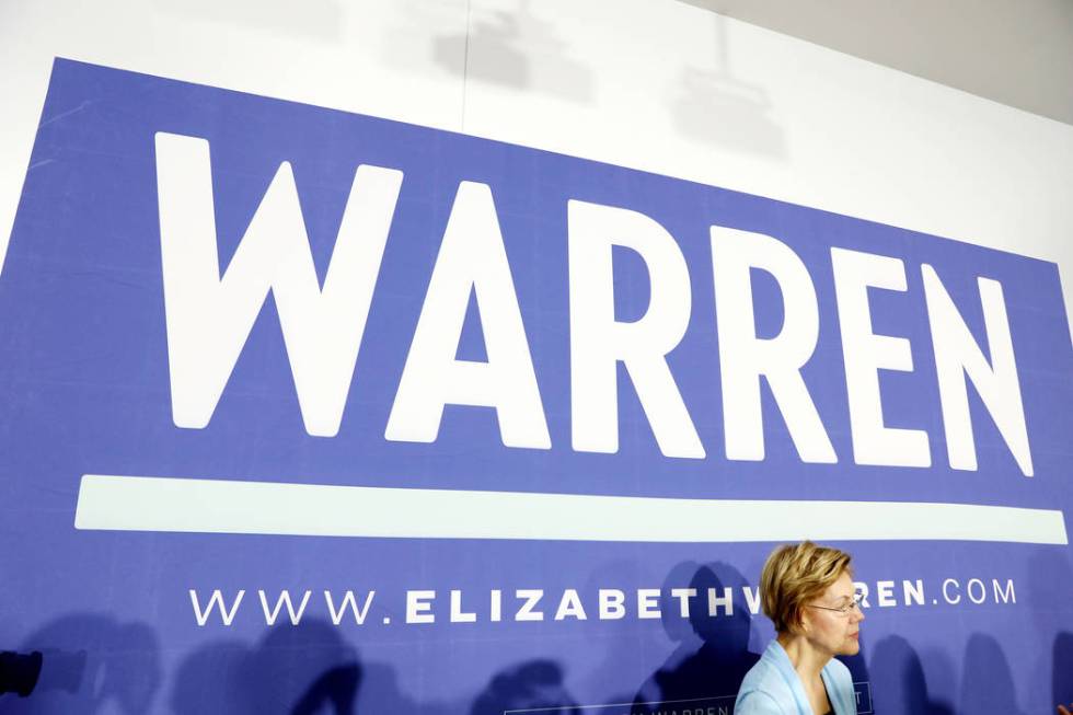 Sen. Elizabeth Warren speaks with supporters after her rally ahead of a town hall at College of ...