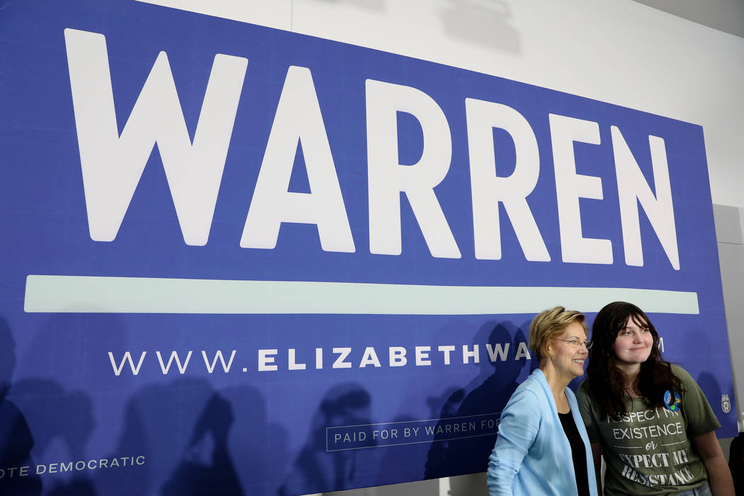 Sen. Elizabeth Warren takes a photograph with Audrey Hanna, 13, of Henderson, after Warren spok ...