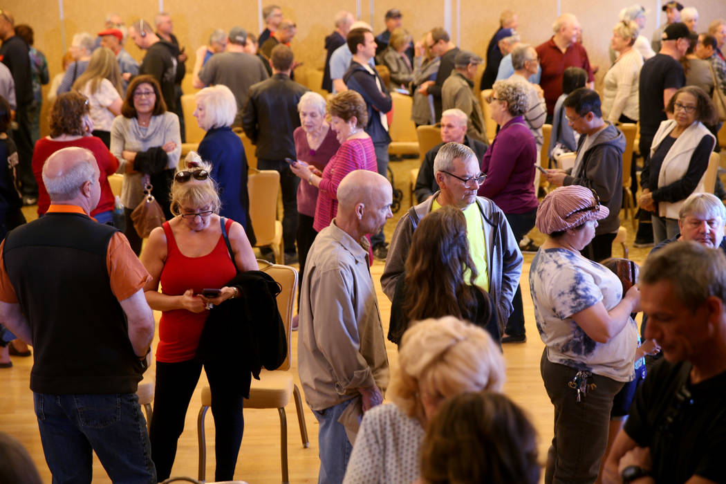 People line up for early voting in the Nevada Democratic caucuses at the Anthem Center in the S ...