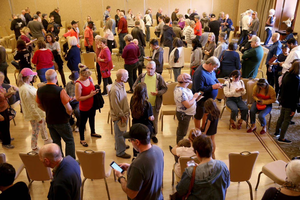 People line up for early voting in the Nevada Democratic caucuses at the Anthem Center in the S ...